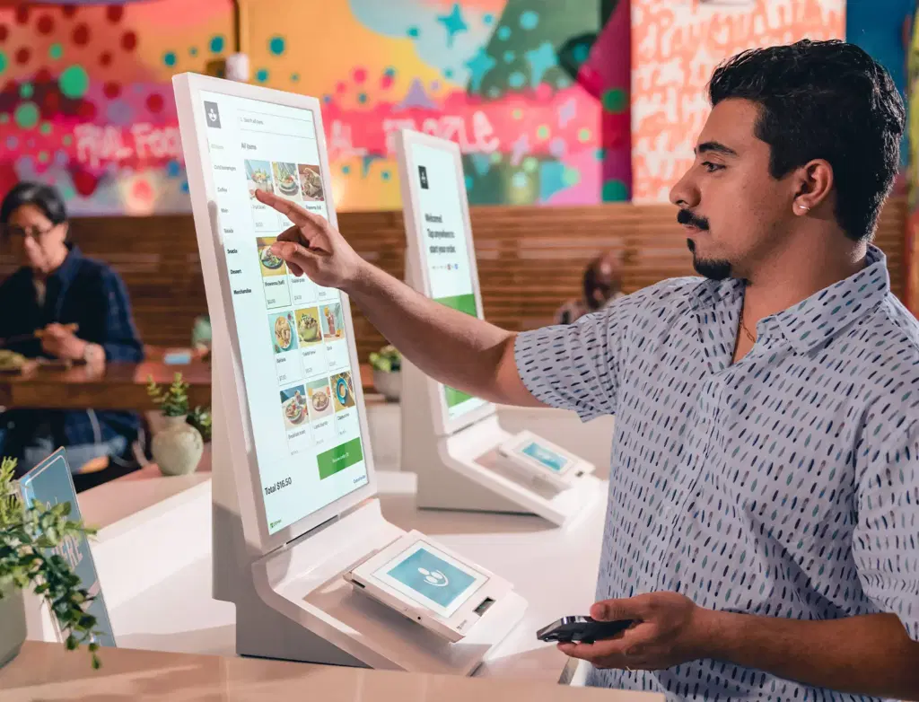 Guests using Clover kiosk